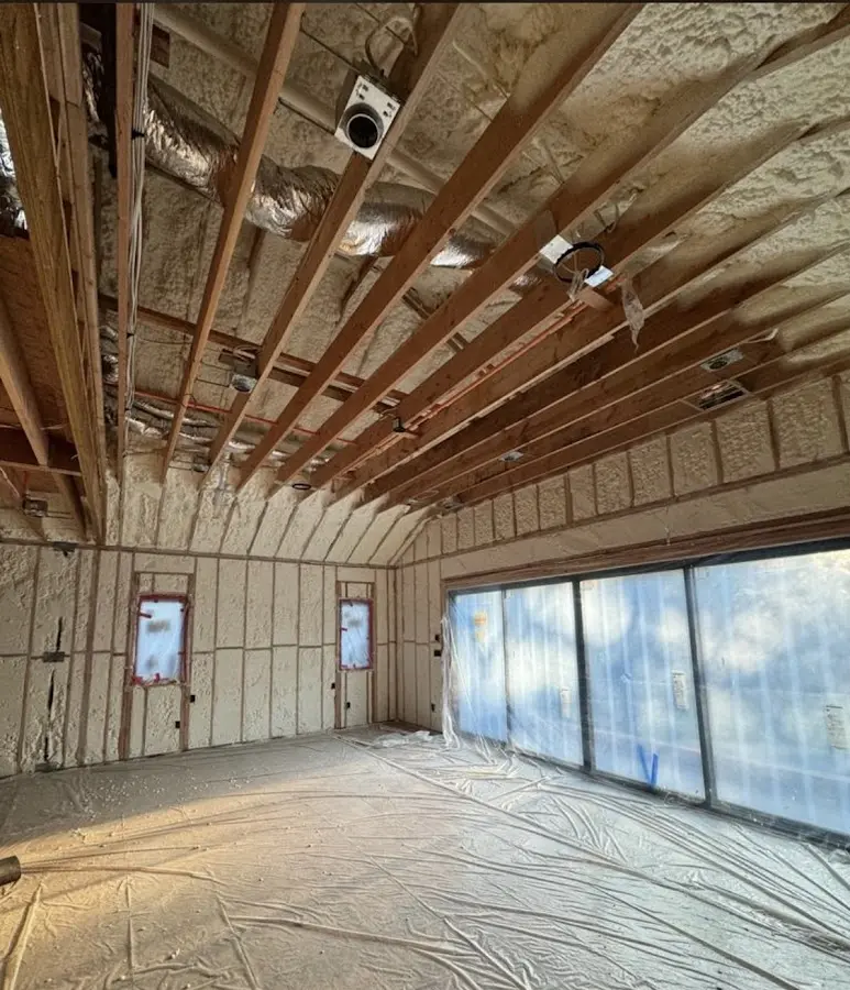 Interior walls and ceiling insulated with spray foam during new construction in South Huntingdon